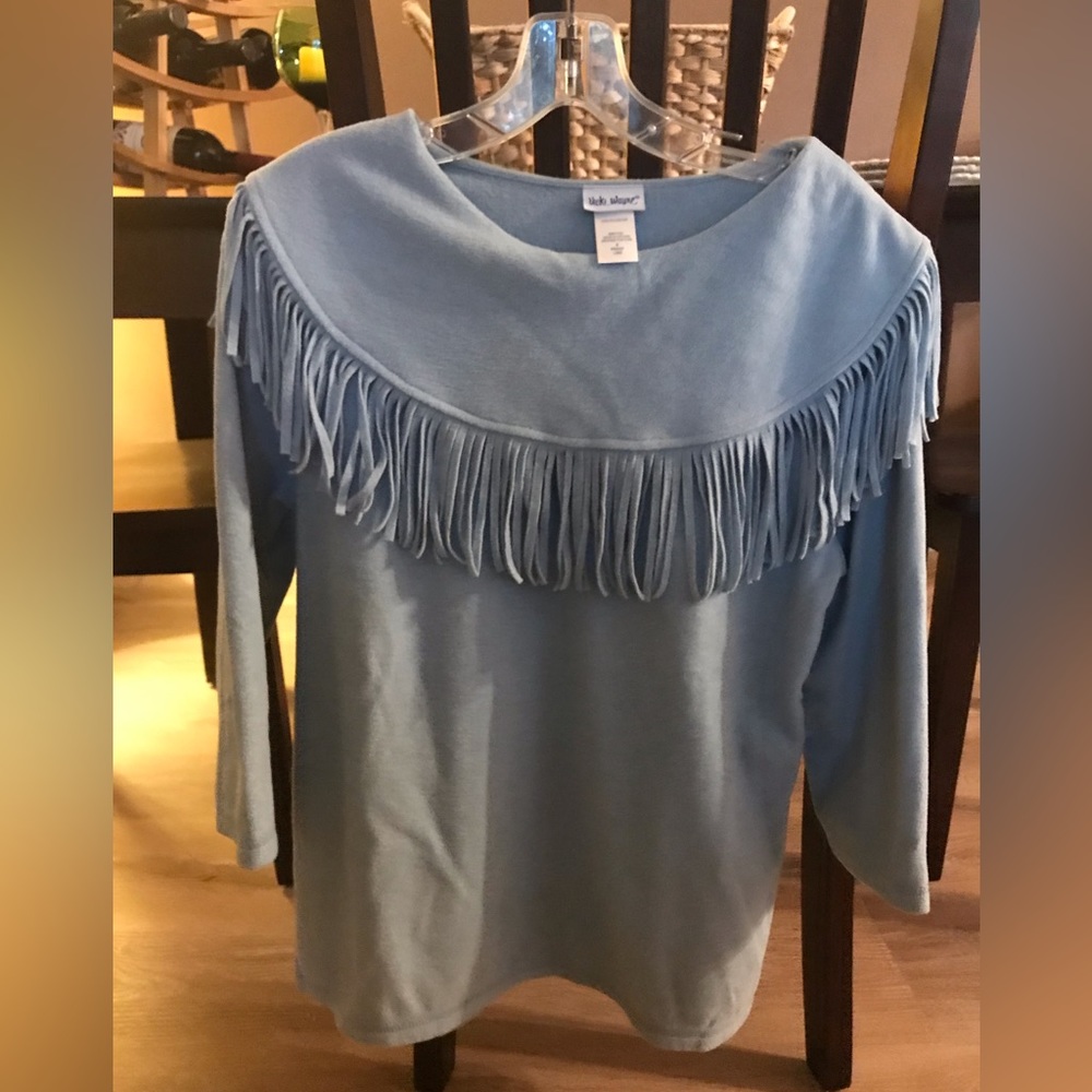 Western flair, fringed detail fleece top